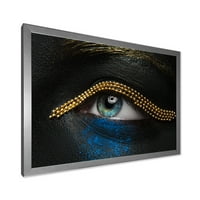 Designart 'Nő szeme fekete bőrrel, arany lánccal' Modern keretes művészeti nyomtatás